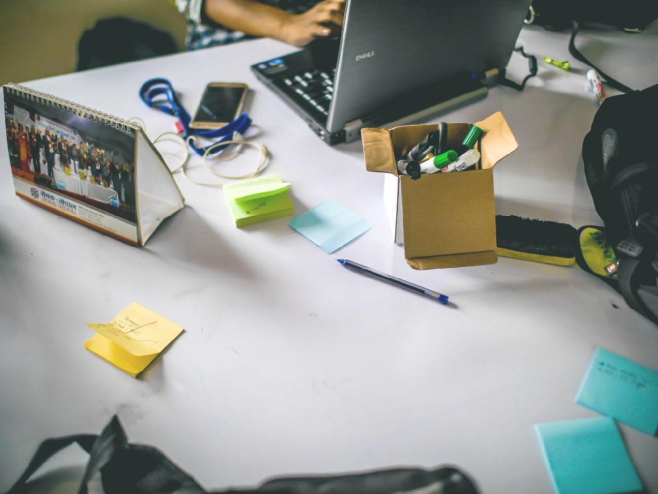 Professional web designer reviewing interface mockups and user experience flows