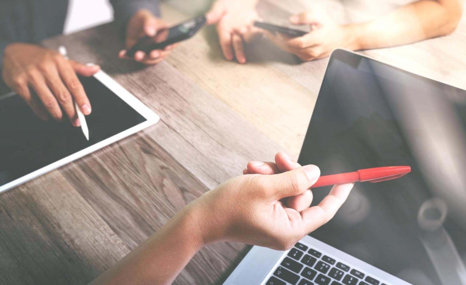 Professional designer working on interface mockups with design tools and color palettes